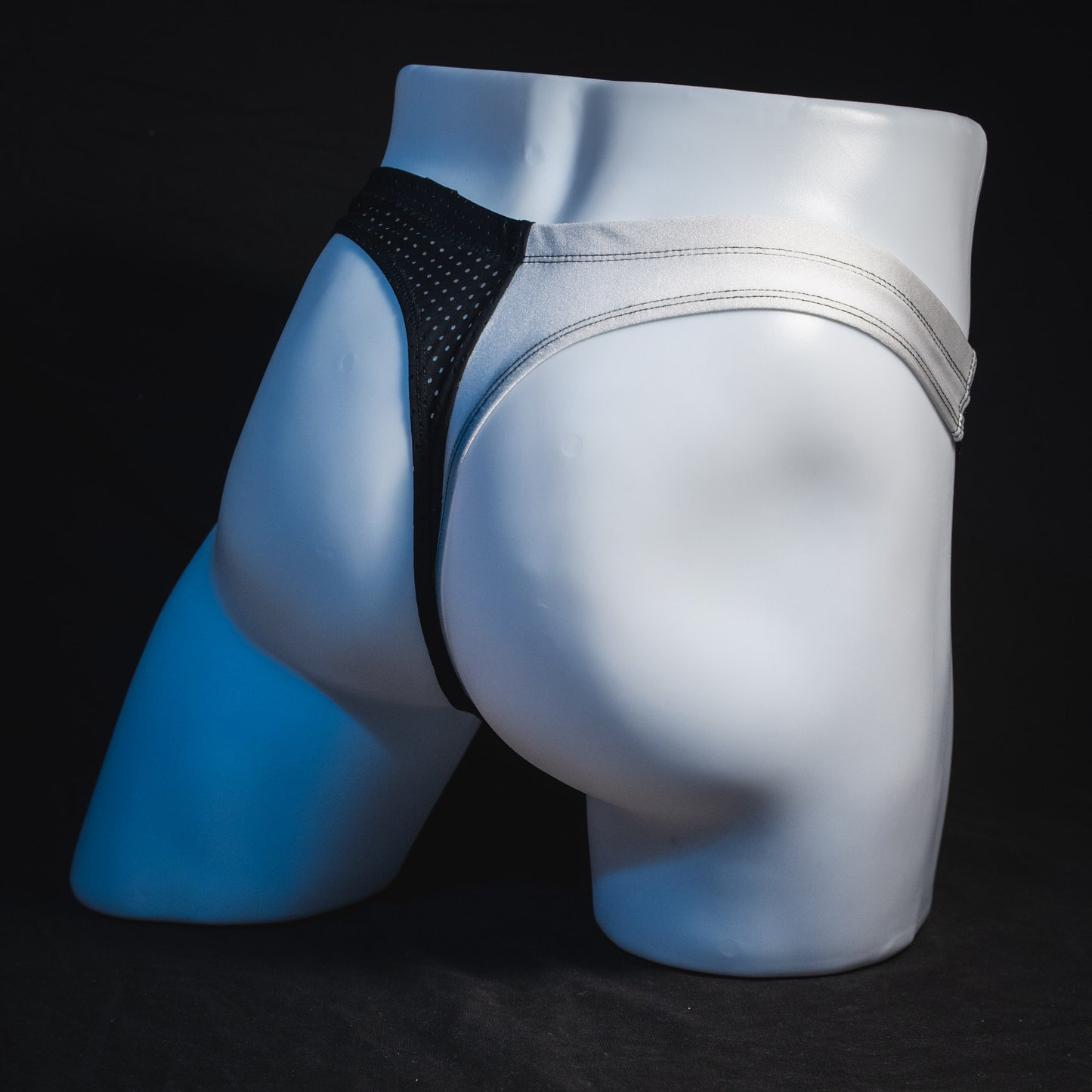 Men's black and white mesh thong underwear, contour cut, Full angled rear view