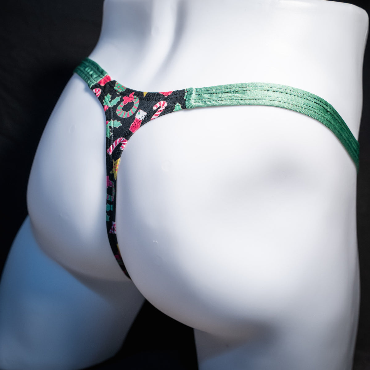 Men's Christmas themed thong underwear, classic cut, rear view.