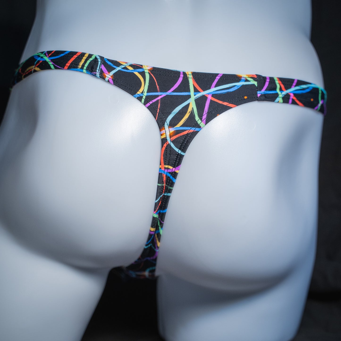 Men's colorful lines thong, classic cut, rear view.