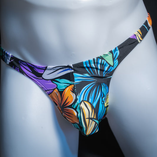 Men's colorful hip floral thong, slim cut, front view.