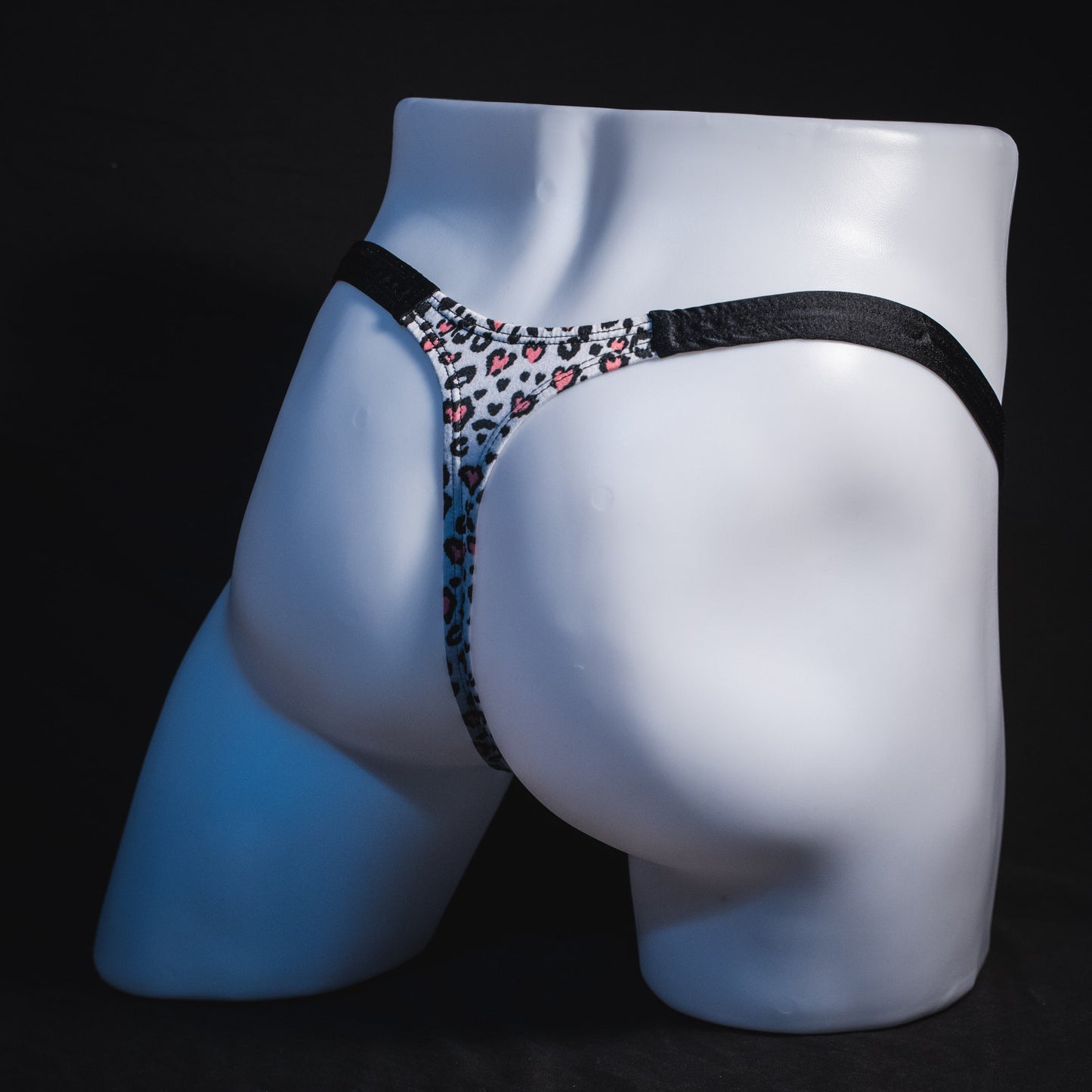 Men's white cheetah with pink hearts thong underwear, classic cut, Full angled rear view