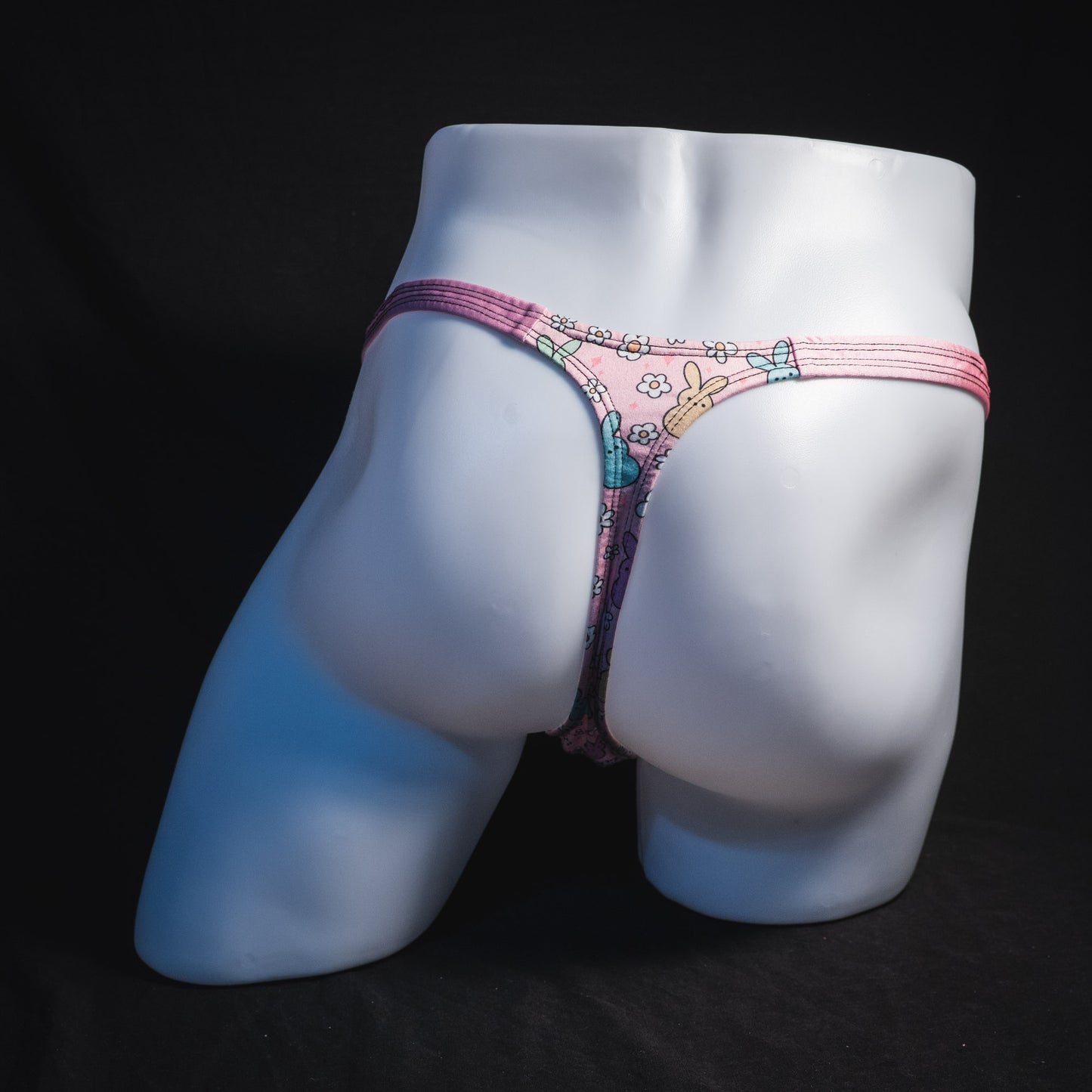 Men's pink easter bunnies thong underwear, classic cut, full rear view.