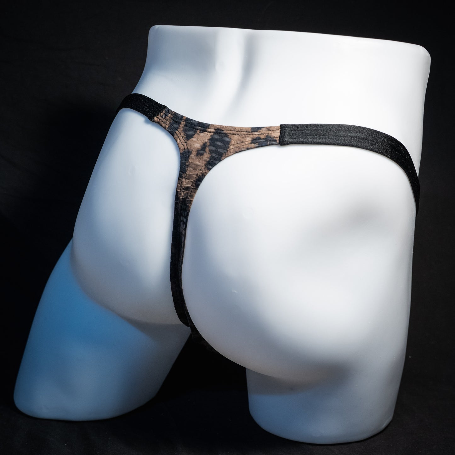 Men's cheetah print mesh thong underwear, classic cut, rear view.