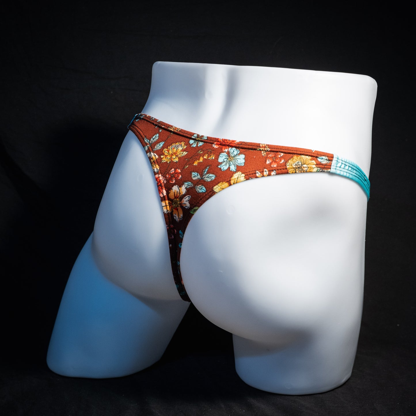Men's floral thong underwear, classic cut, back view.