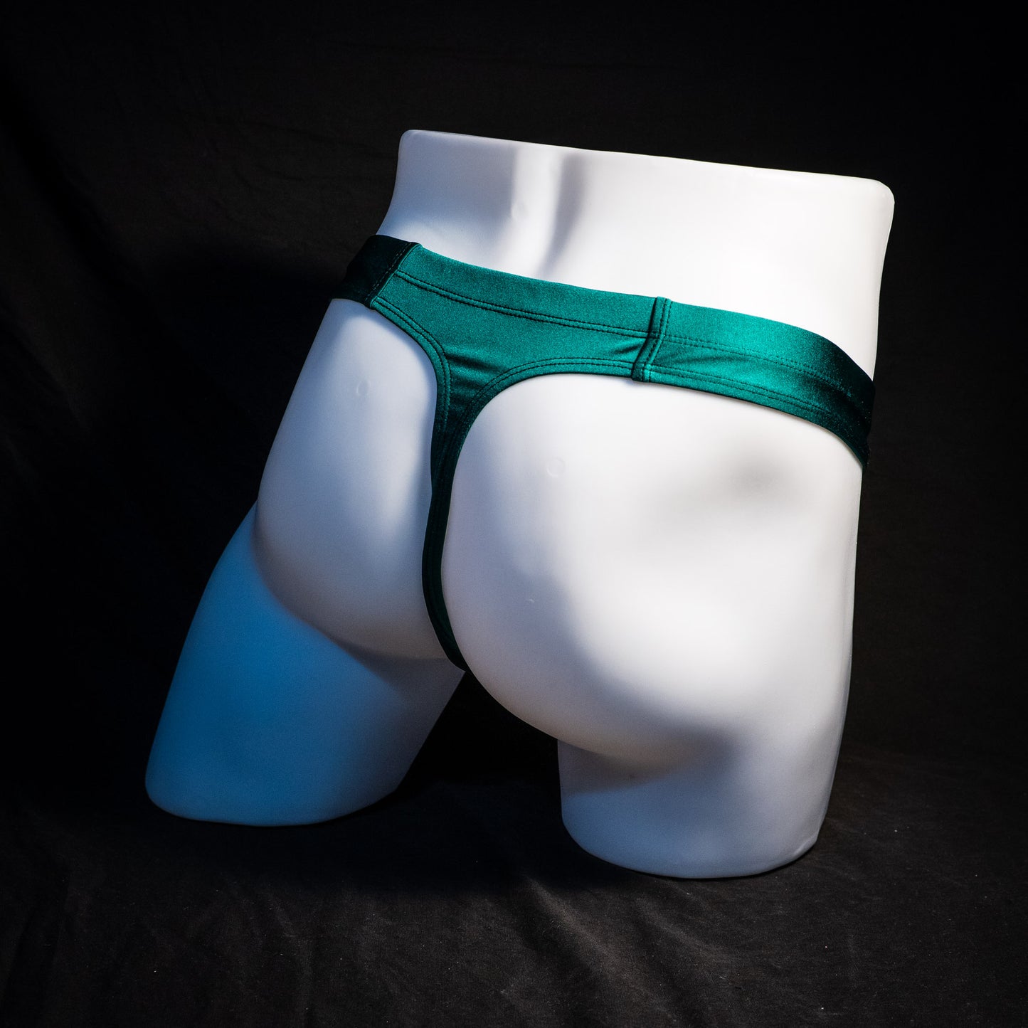 Men's pouchless forest green thong underwear, Full angled rear view