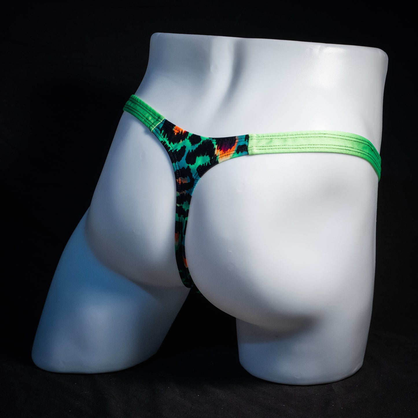 Men's green cheetah thong underwear, classic cut, rear view.