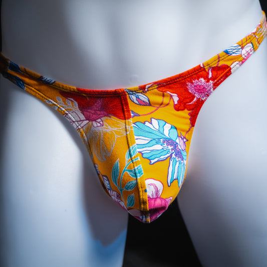Men's vintage orange floral thong, slim cut, front view.
