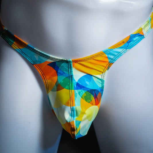 Men's colorful orb thong, slim cut, front view.