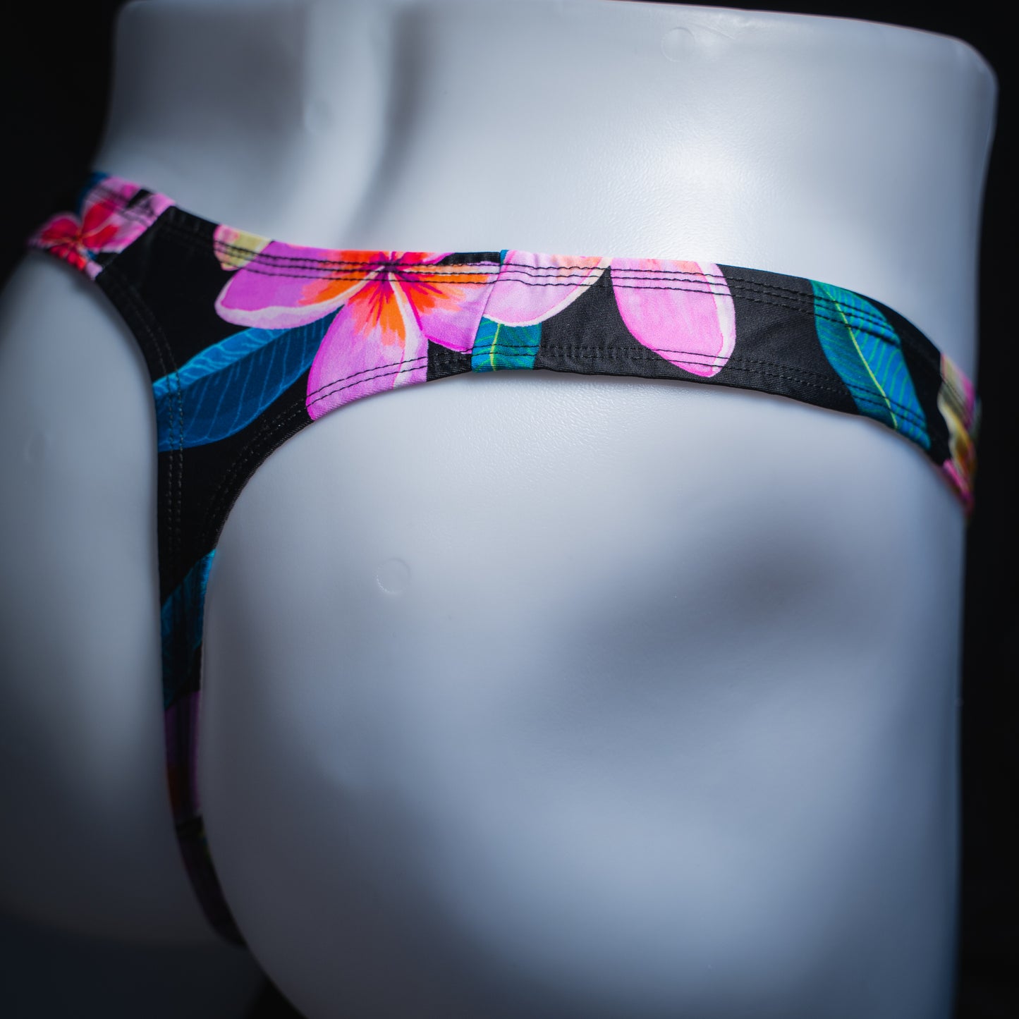 handmade mens thong underwear, pink floral pattern, spandex material, robust cut design, angled back view