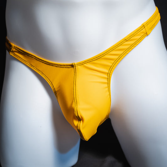 Men's solid golden yellow thong, slim cut, front view.