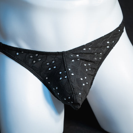 handmade mens thong underwear, solid black eyelets, soft polyester material, classic cut variation, front view