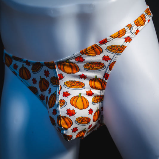 Men's pumpkin pie Thanksgiving thong underwear, classic cut, angled front view.