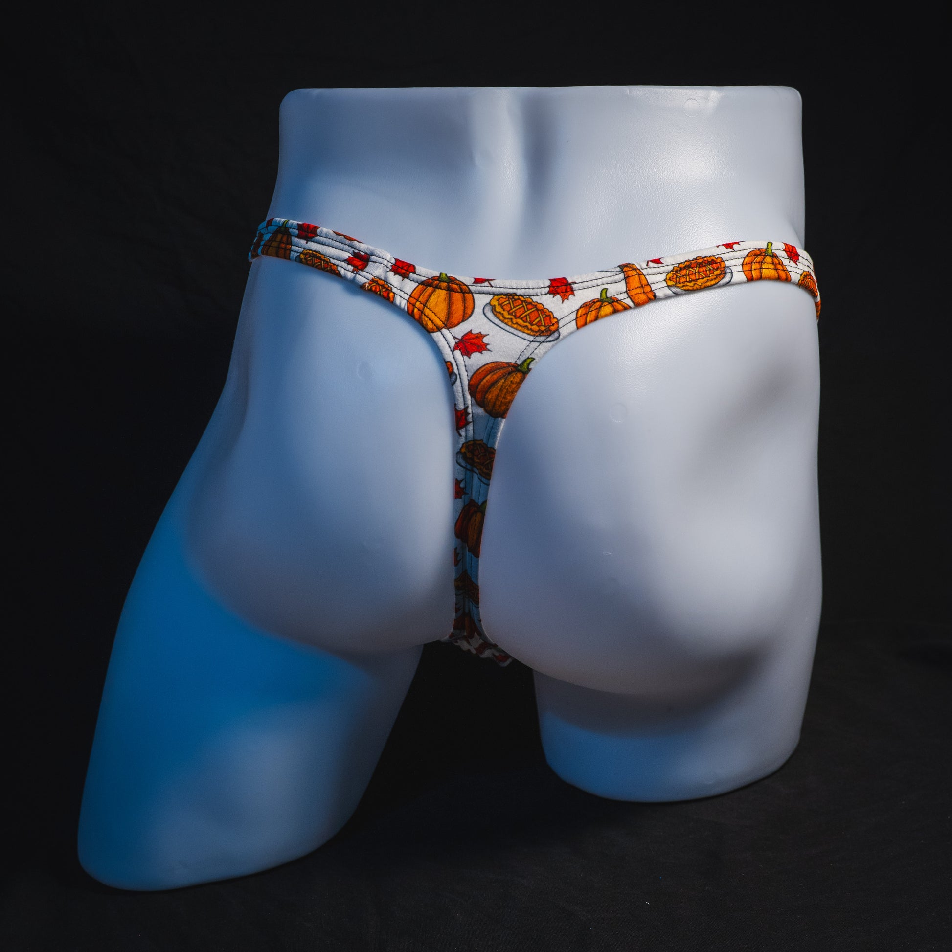 Men's pumpkin pie Thanksgiving thong underwear, classic cut, full rear view.