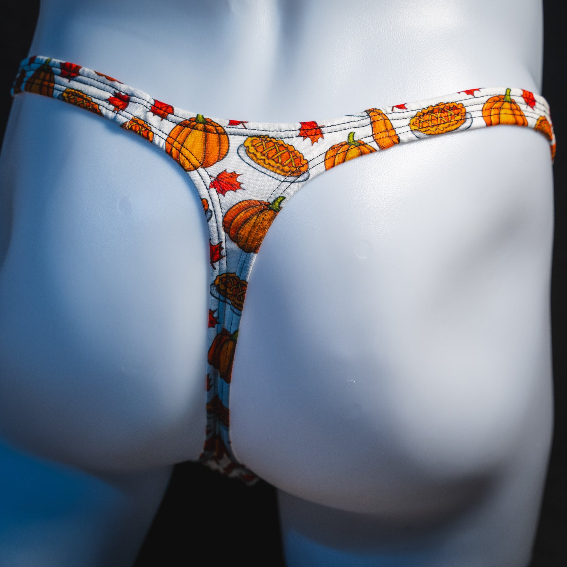 Men's pumpkin pie Thanksgiving thong underwear, classic cut, rear view.