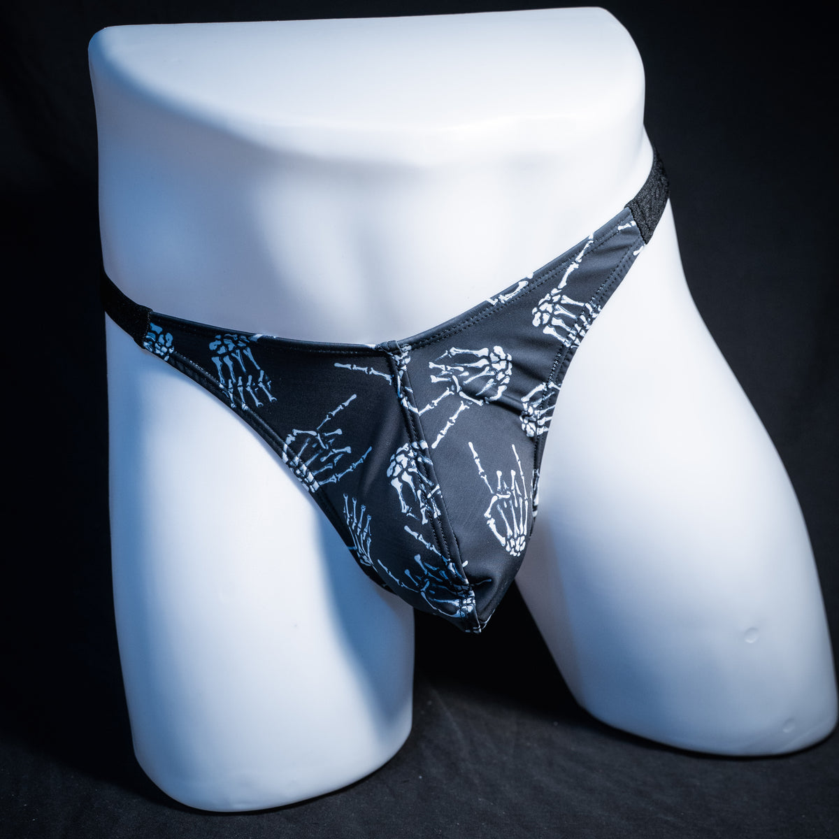 Men's skeleton hands thong underwear, classic cut, front view.