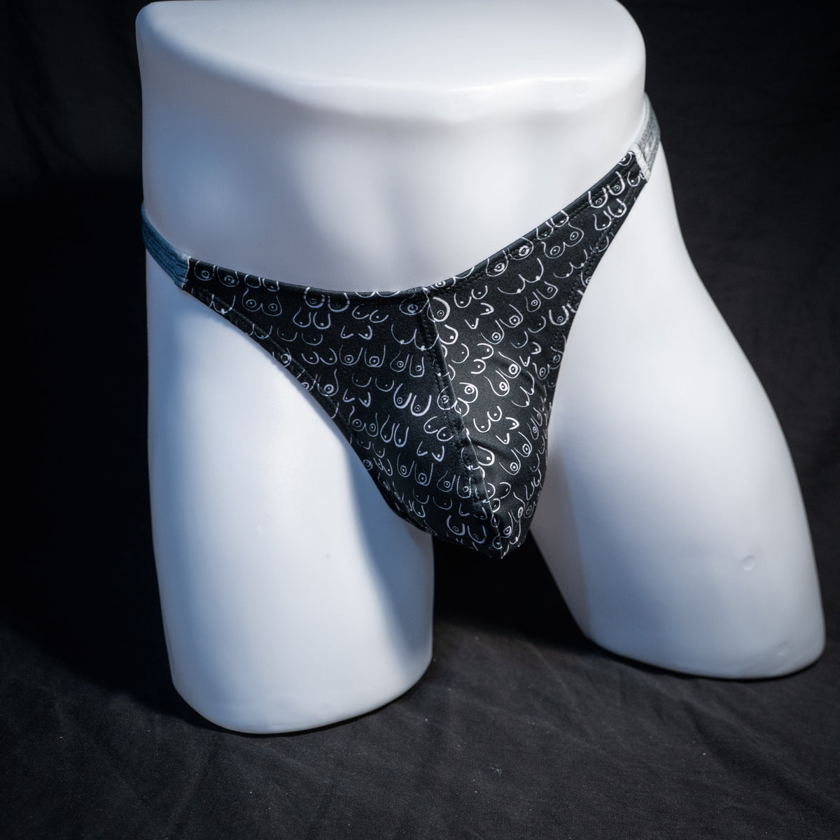 Men's boob patterned thong underwear, classic cut, front view.
