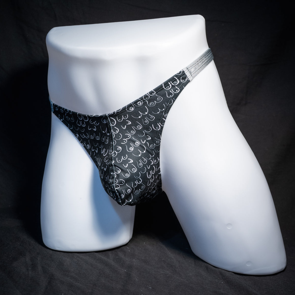 Men's boob patterned thong underwear, classic cut, front view.