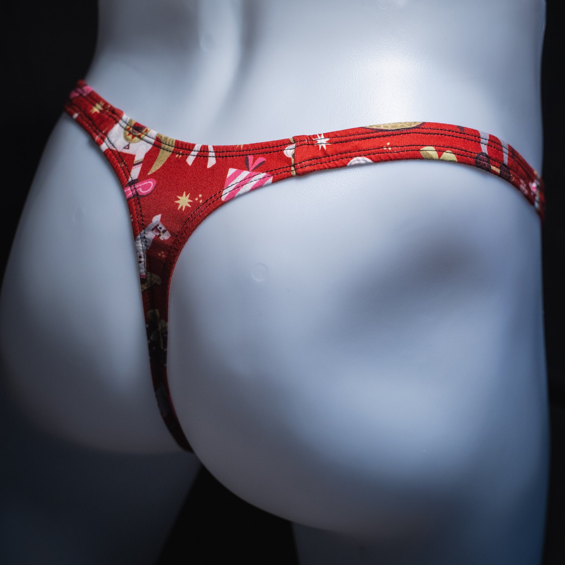 Men's Christmas gifts thong underwear, slim cut, angled rear view.