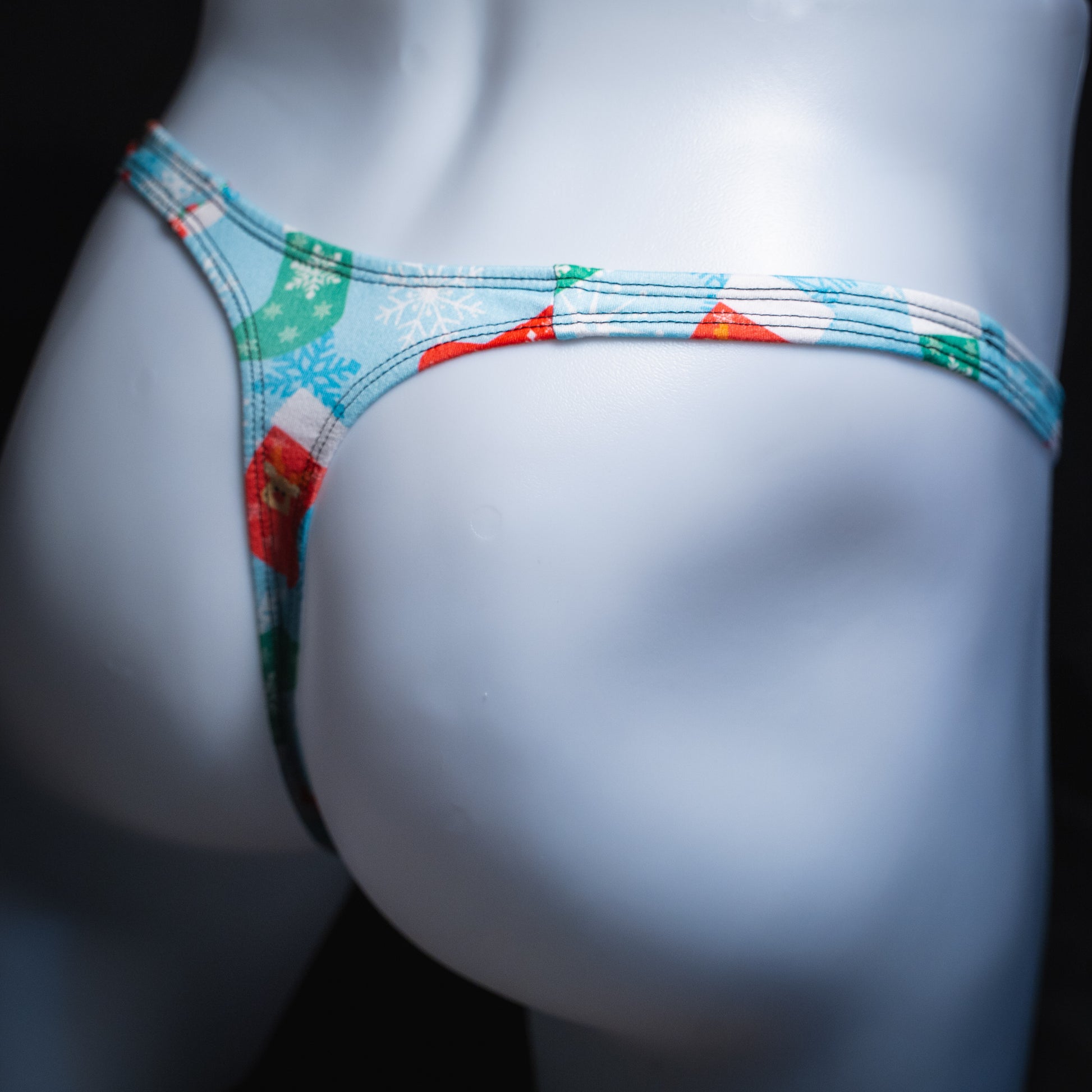 Men's Christmas stocking thong underwear, Classic cut, angled rear view.