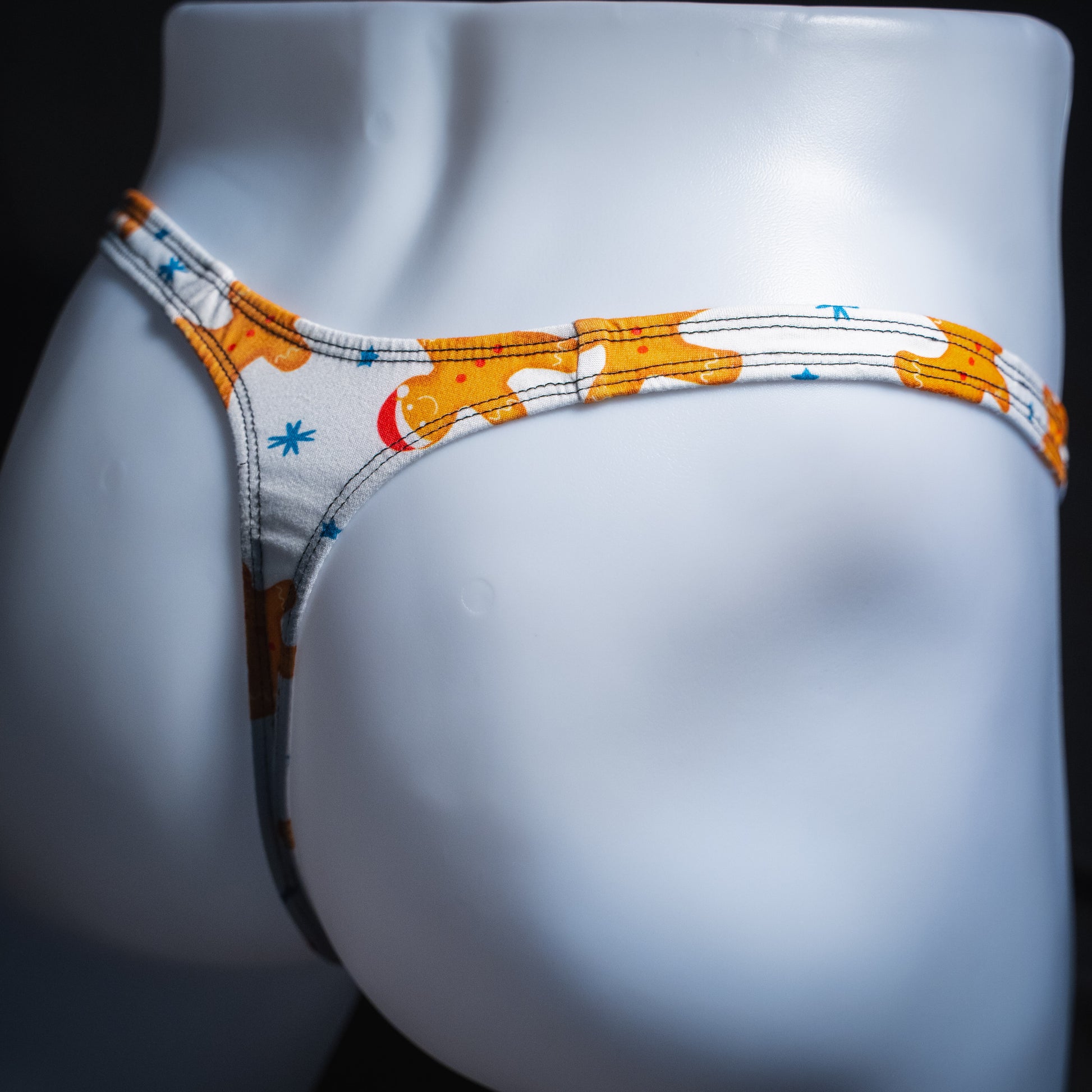 Men's white with gingerbread men thong underwear, slim cut,