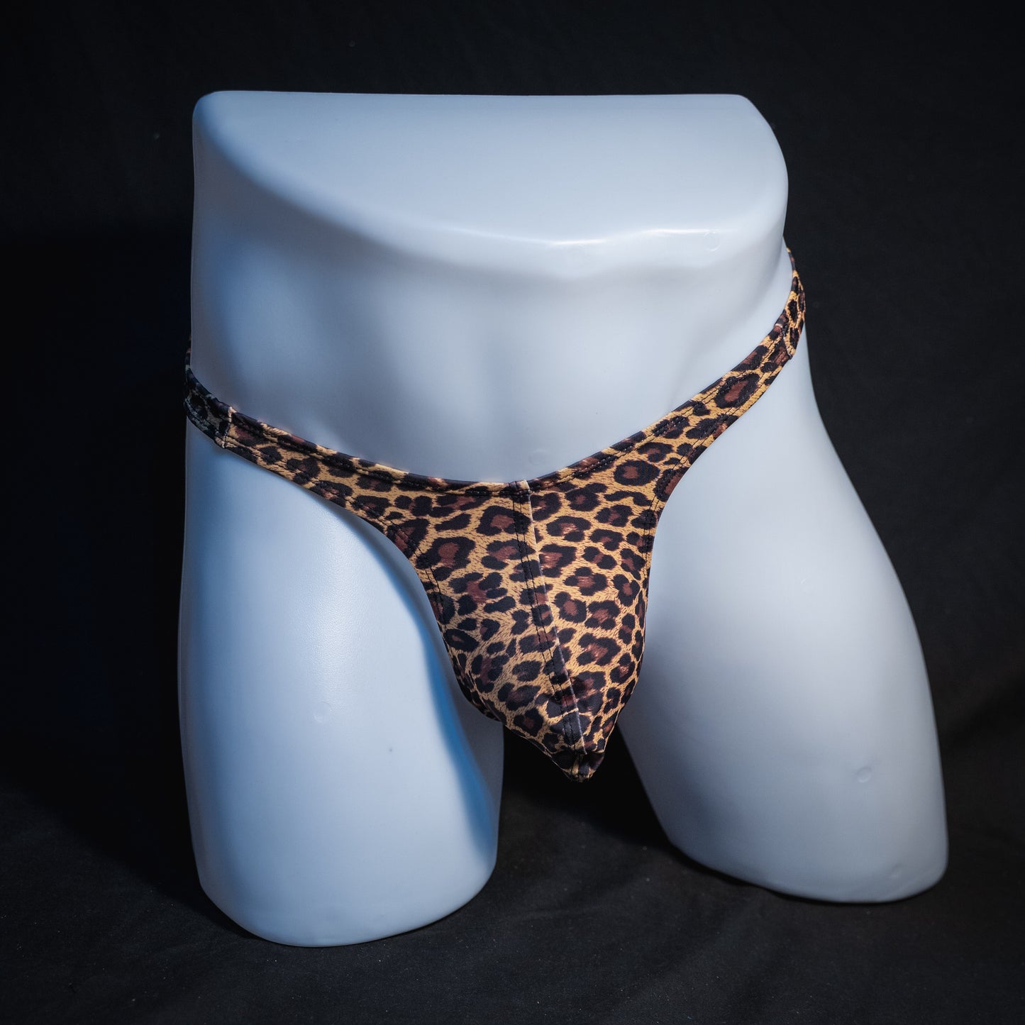 Men's brown leopard thong underwear, slim cut, full front view.