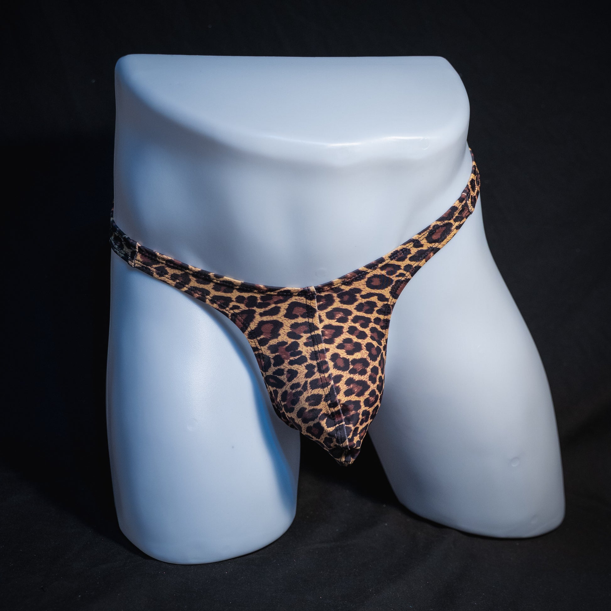 Men's brown leopard thong underwear, slim cut, full front view.