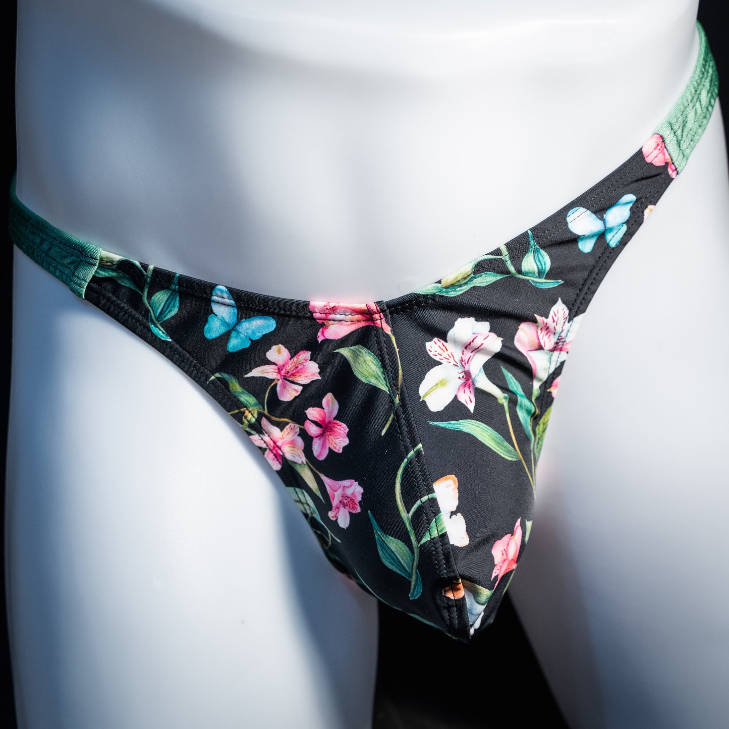 Men's floral thong underwear. classic cut, front view.