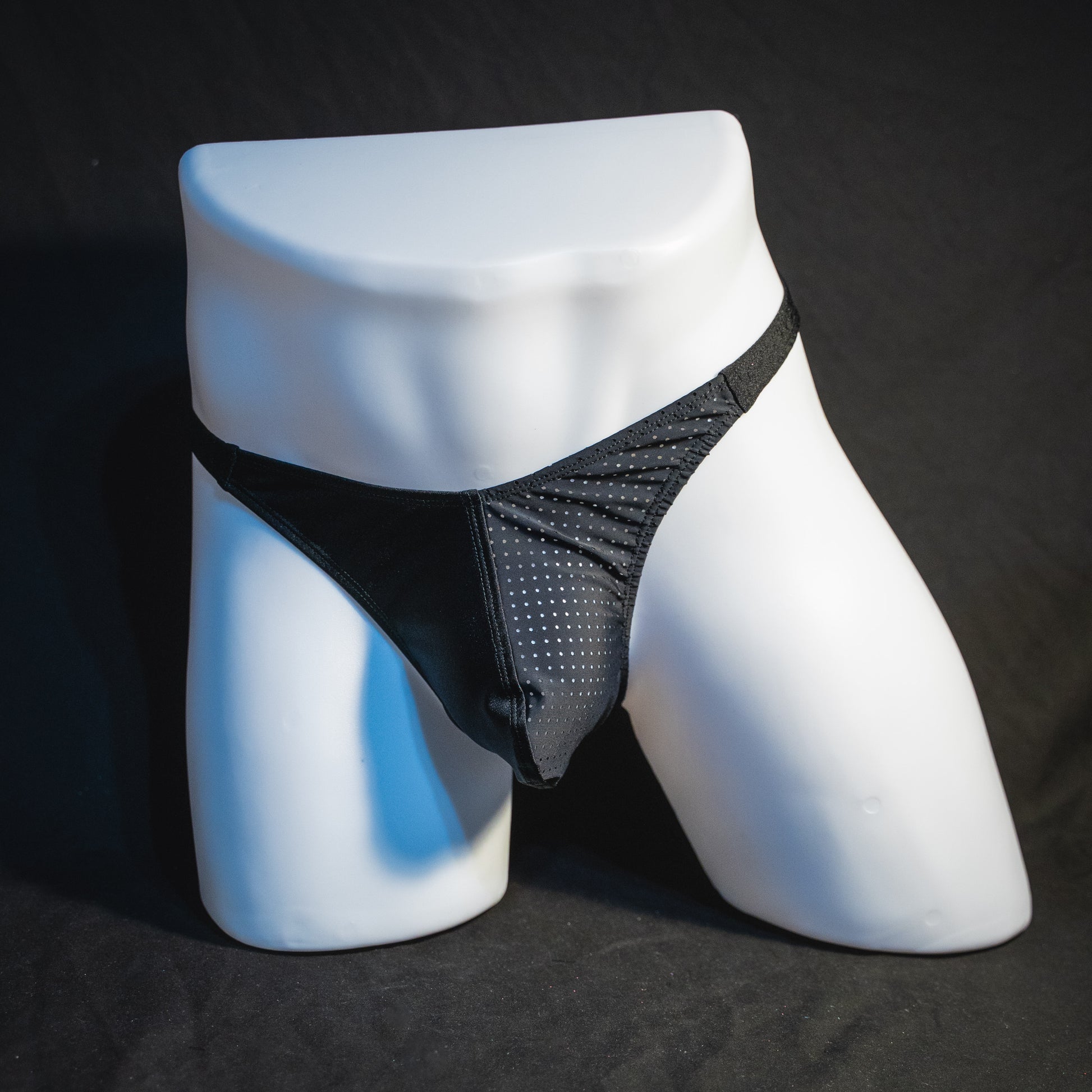 Men's half mesh solid black thong underwear, classic cut, full front view.