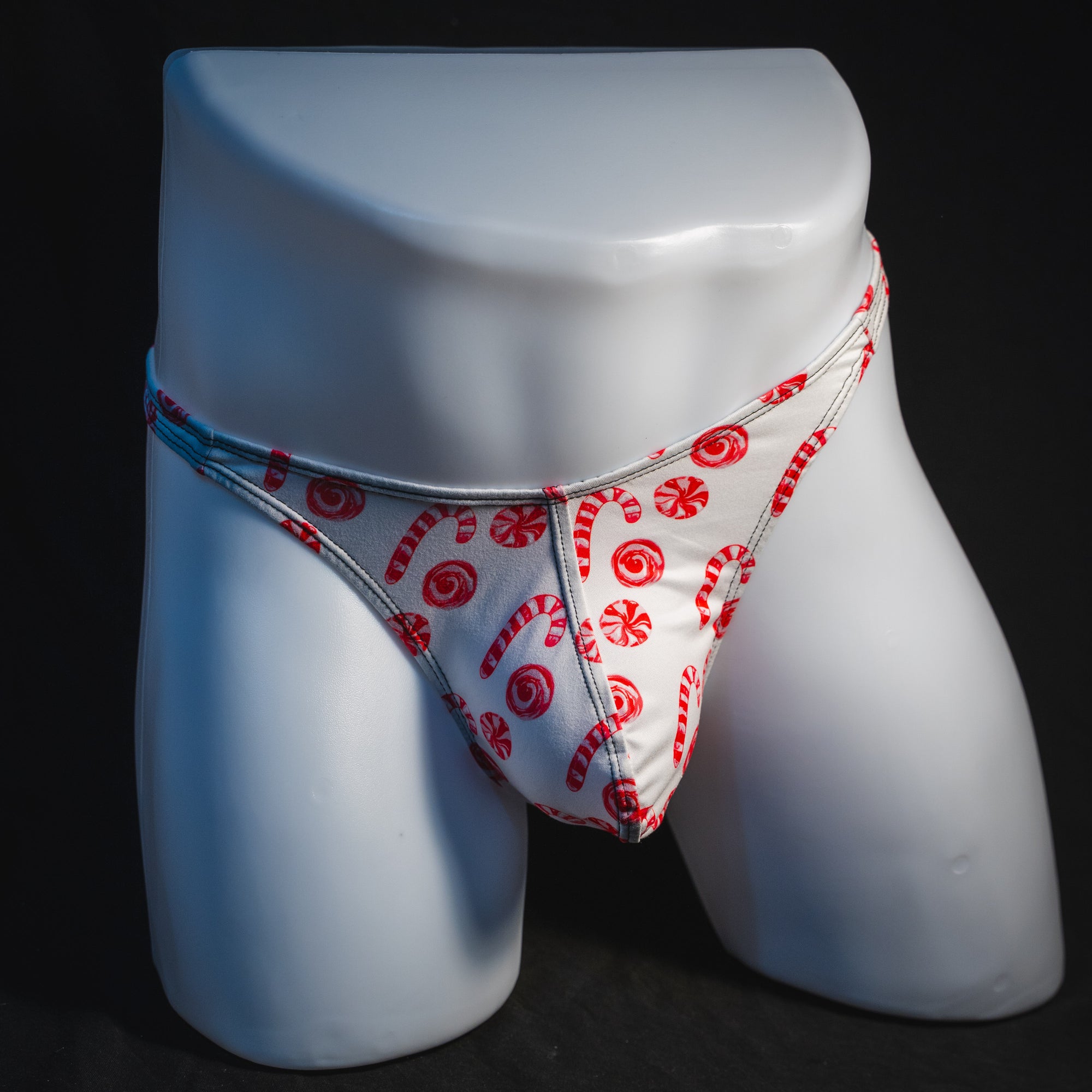 Men's peppermint candies Christmas thong underwear, classic cut, full front view.