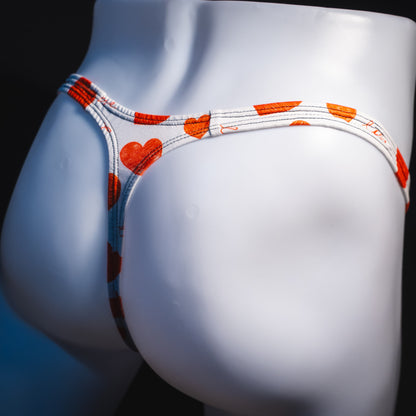 Men's red hearts Valentine's Day thong underwear, Classic cut, angled rear view.