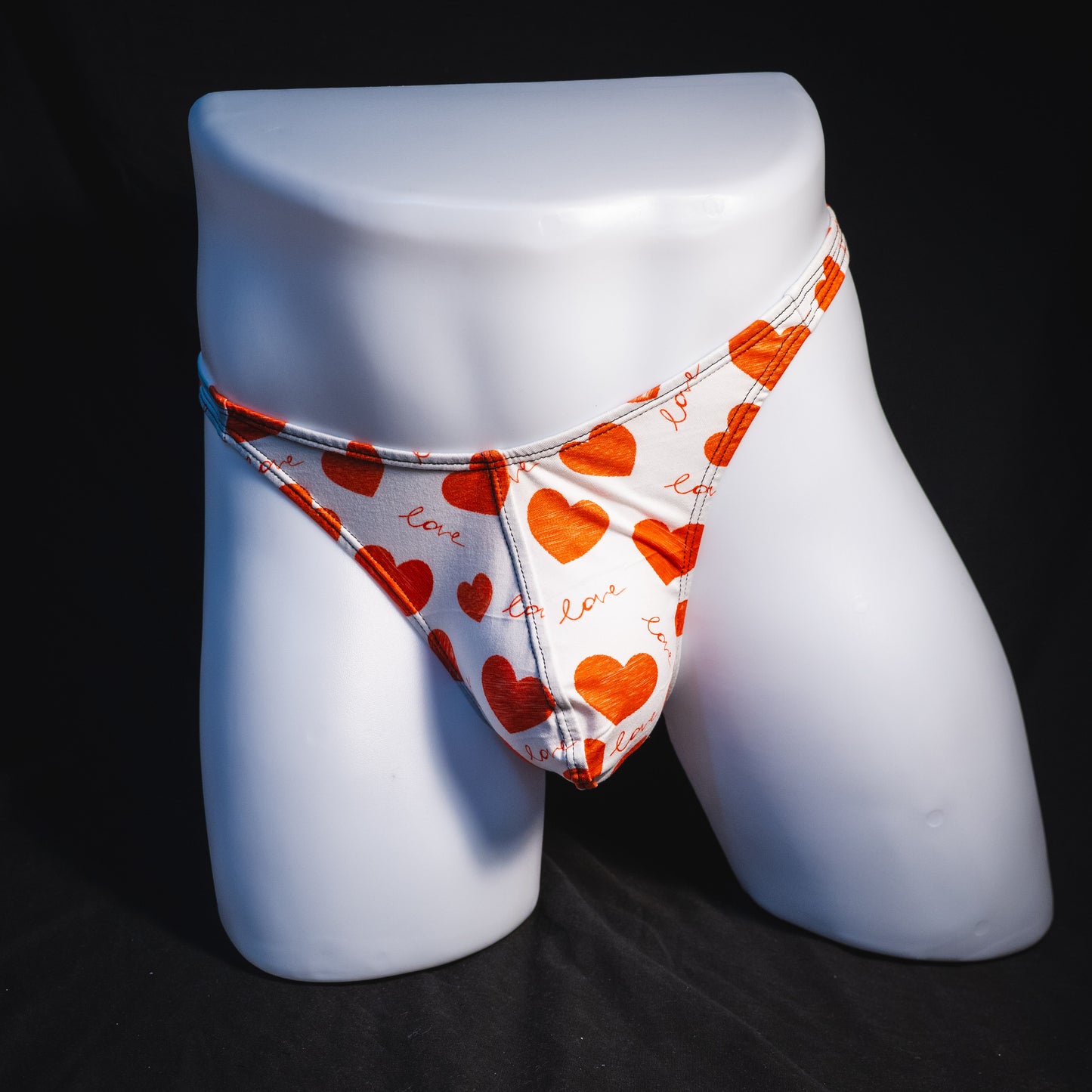 Men's red hearts Valentine's Day thong underwear, Classic cut, full front view.