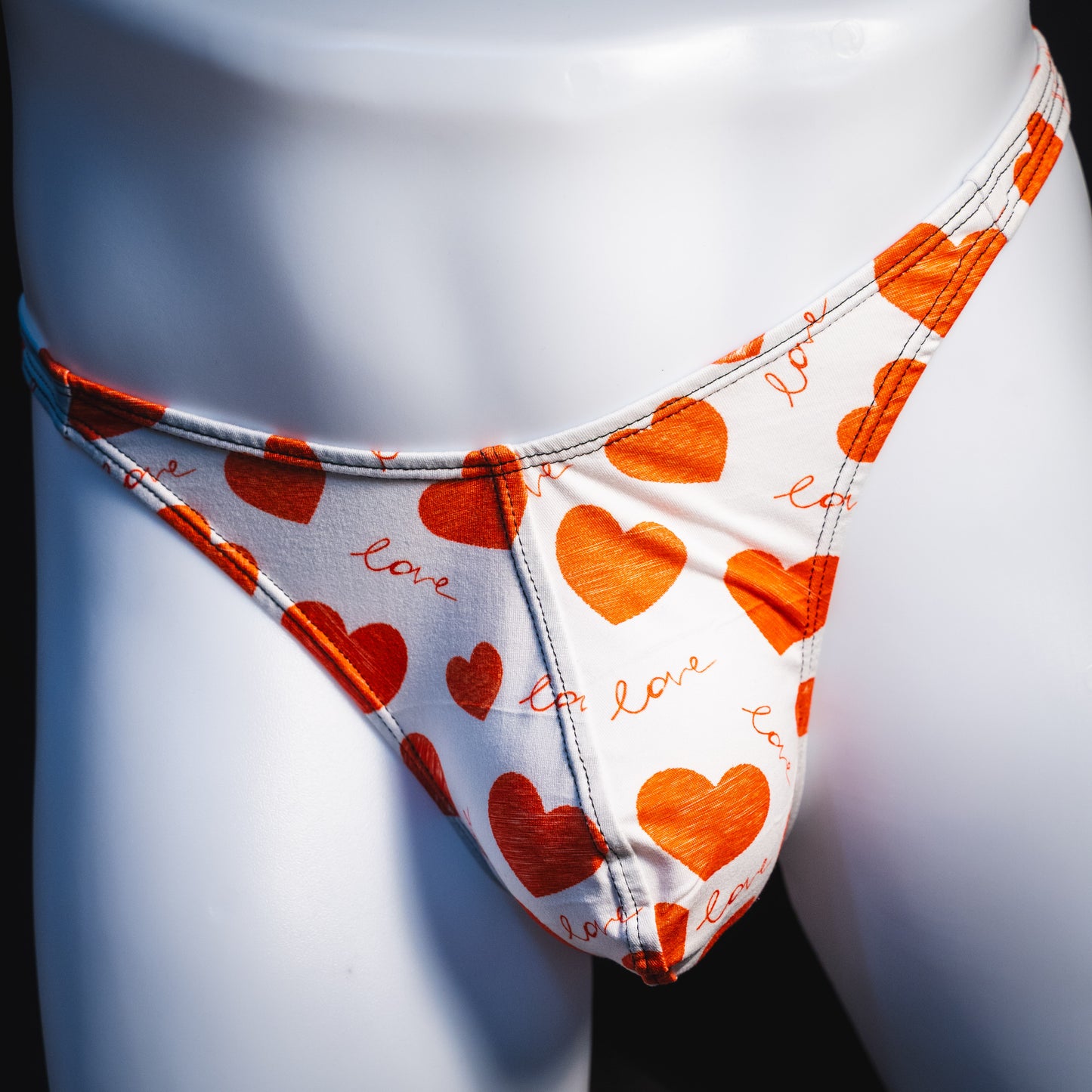 Men's red hearts Valentine's Day thong underwear, Classic cut, front view.