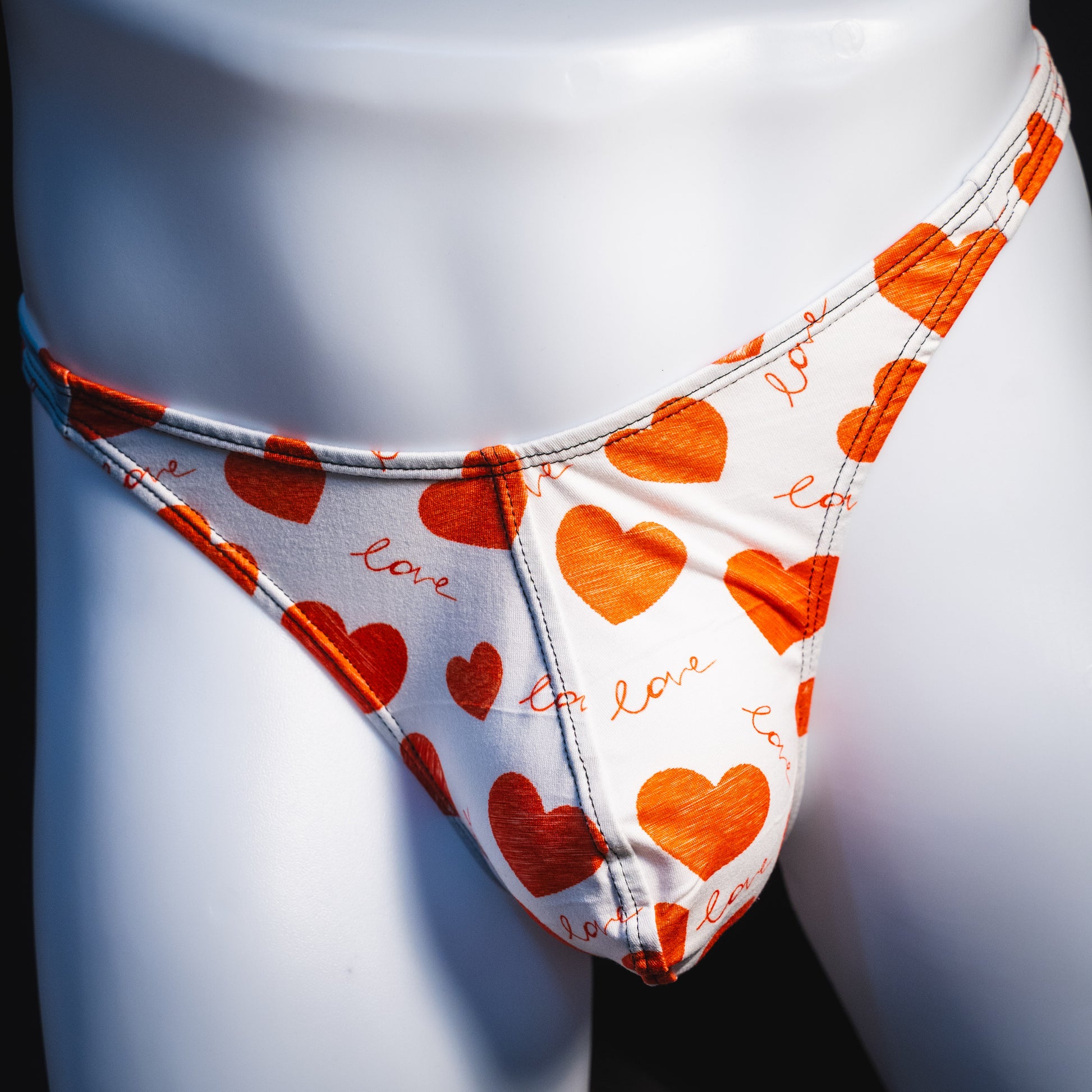 Men's red hearts Valentine's Day thong underwear, Classic cut, front view.