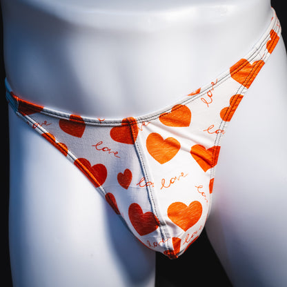 Men's red hearts Valentine's Day thong underwear, Classic cut, front view.