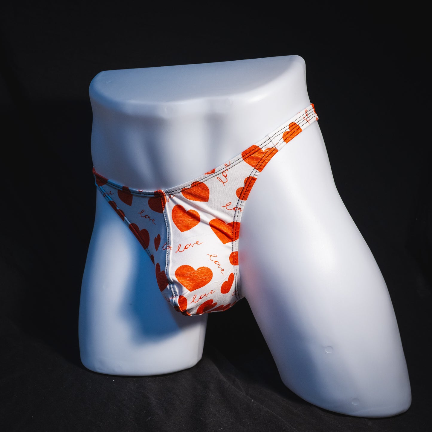 Men's red hearts Valentine's Day thong underwear, Classic cut, full angled front view.