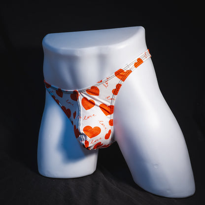 Men's red hearts Valentine's Day thong underwear, Classic cut, full angled front view.
