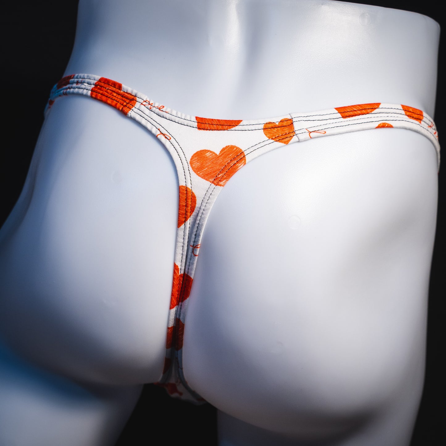 Men's red hearts Valentine's Day thong underwear, Classic cut, rear view.