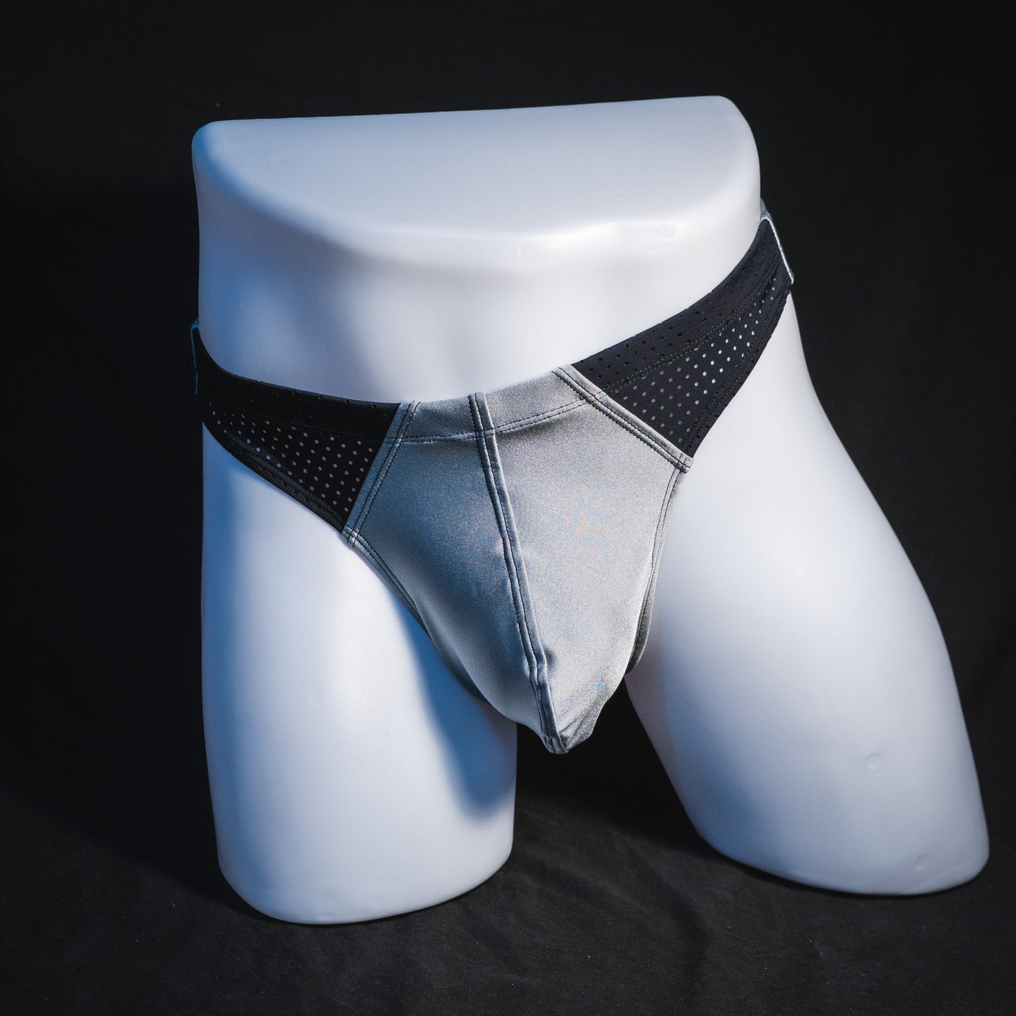 Men's silver with black mesh panels thong underwear, contour cut, full front view.