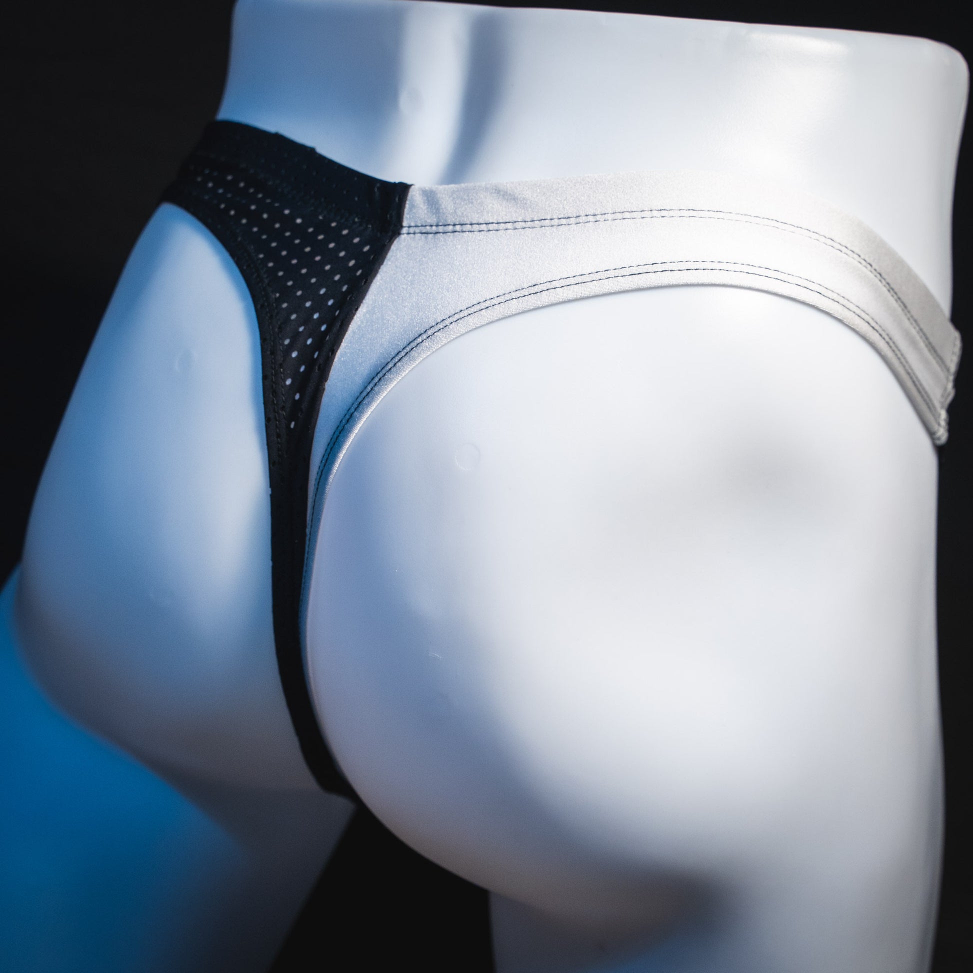 Men's black and white mesh thong underwear, contour cut, Angled rear view