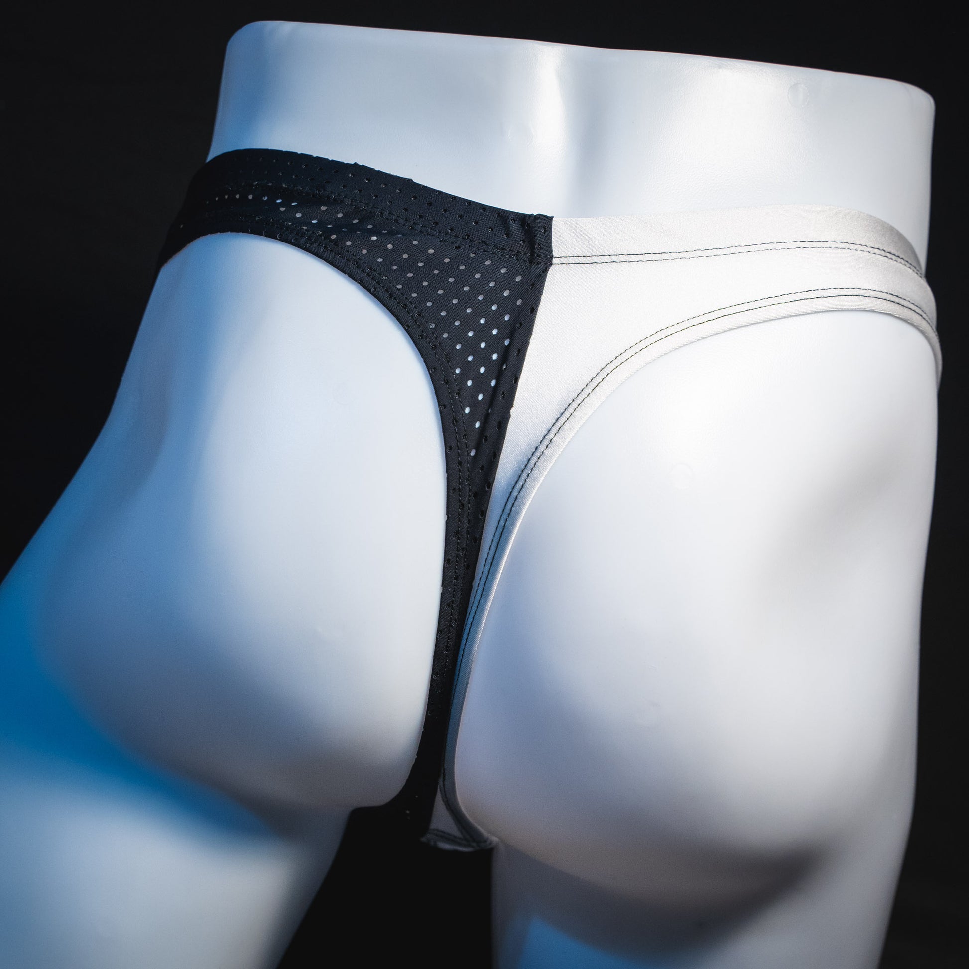 Men's black and white mesh thong underwear, contour cut, Rear view