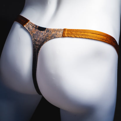 Men's black skulls on brown thong underwear, Classic cut, rear view.