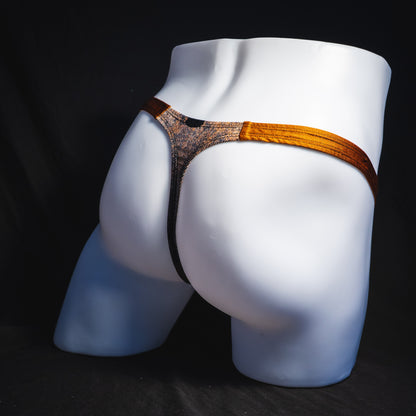 Men's black skulls on brown thong underwear, Classic cut, full angled rear view.