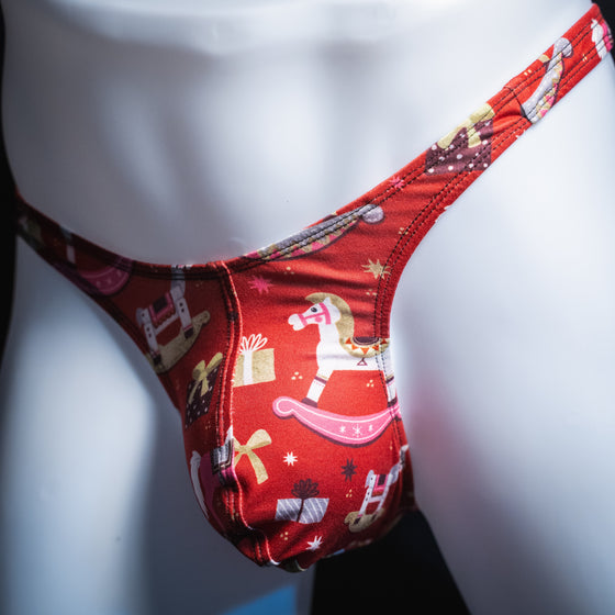 Men's Christmas gifts thong underwear, slim cut, angled front view.