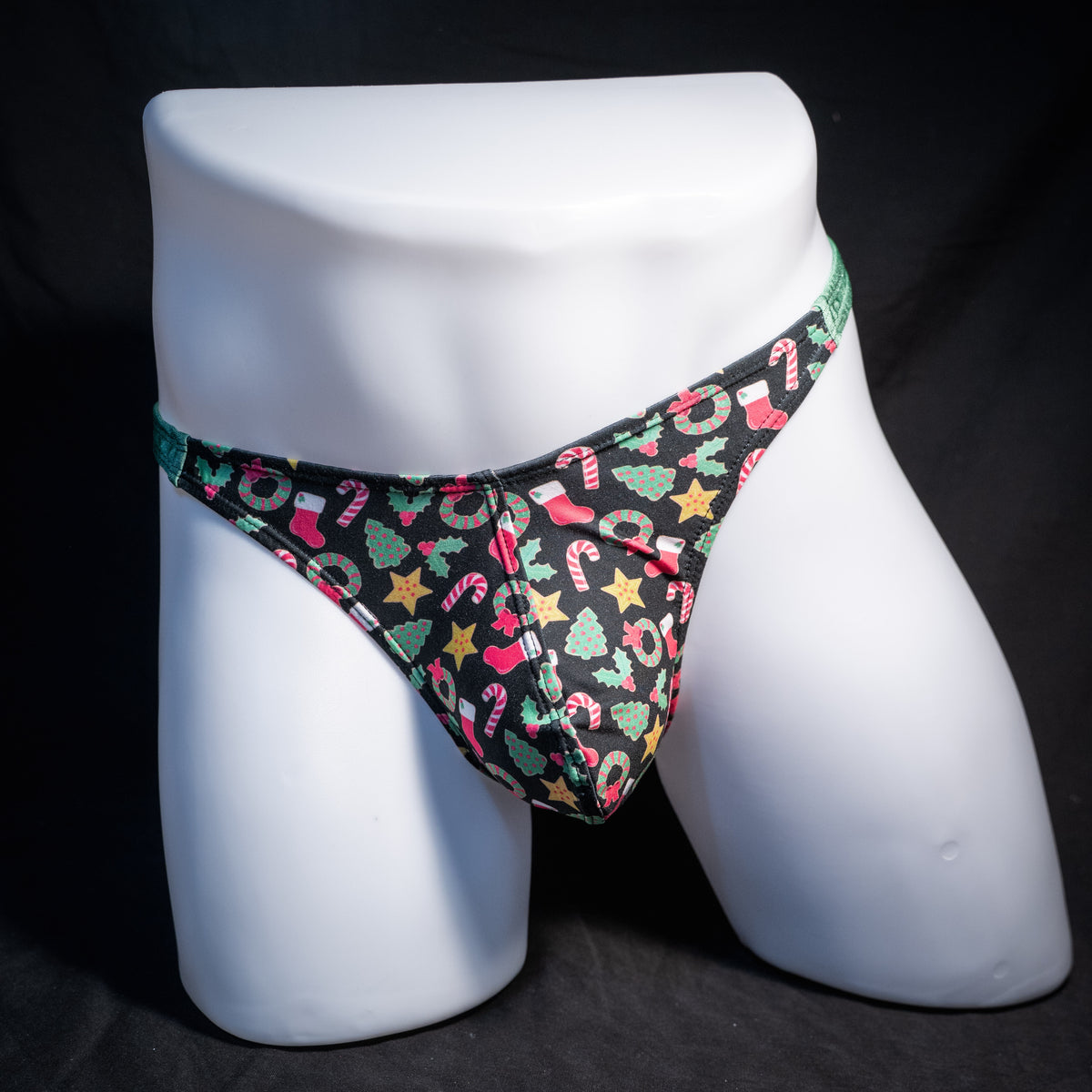 Men's Christmas themed thong underwear, classic cut, front view.