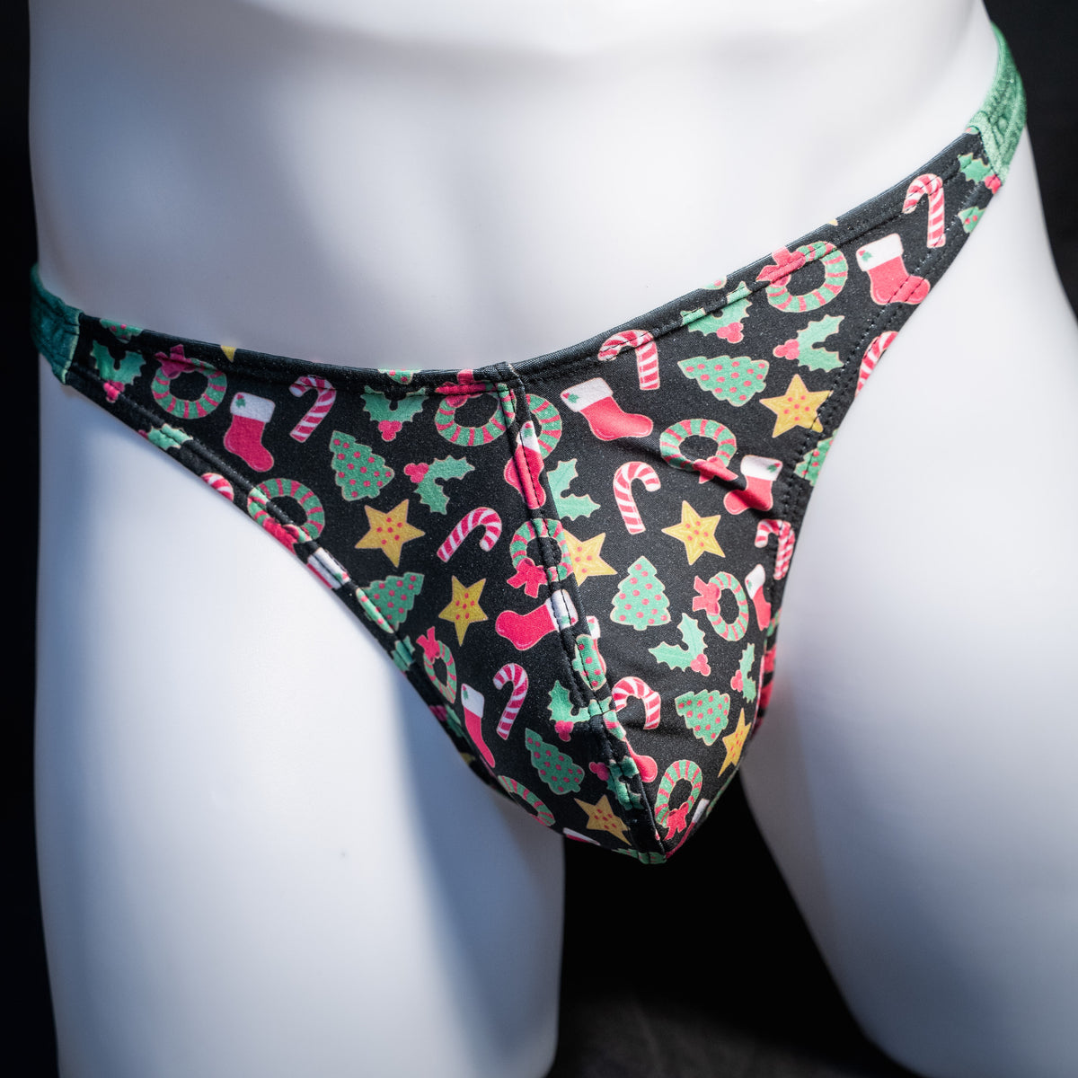 Men's Christmas themed thong underwear, classic cut, front view.