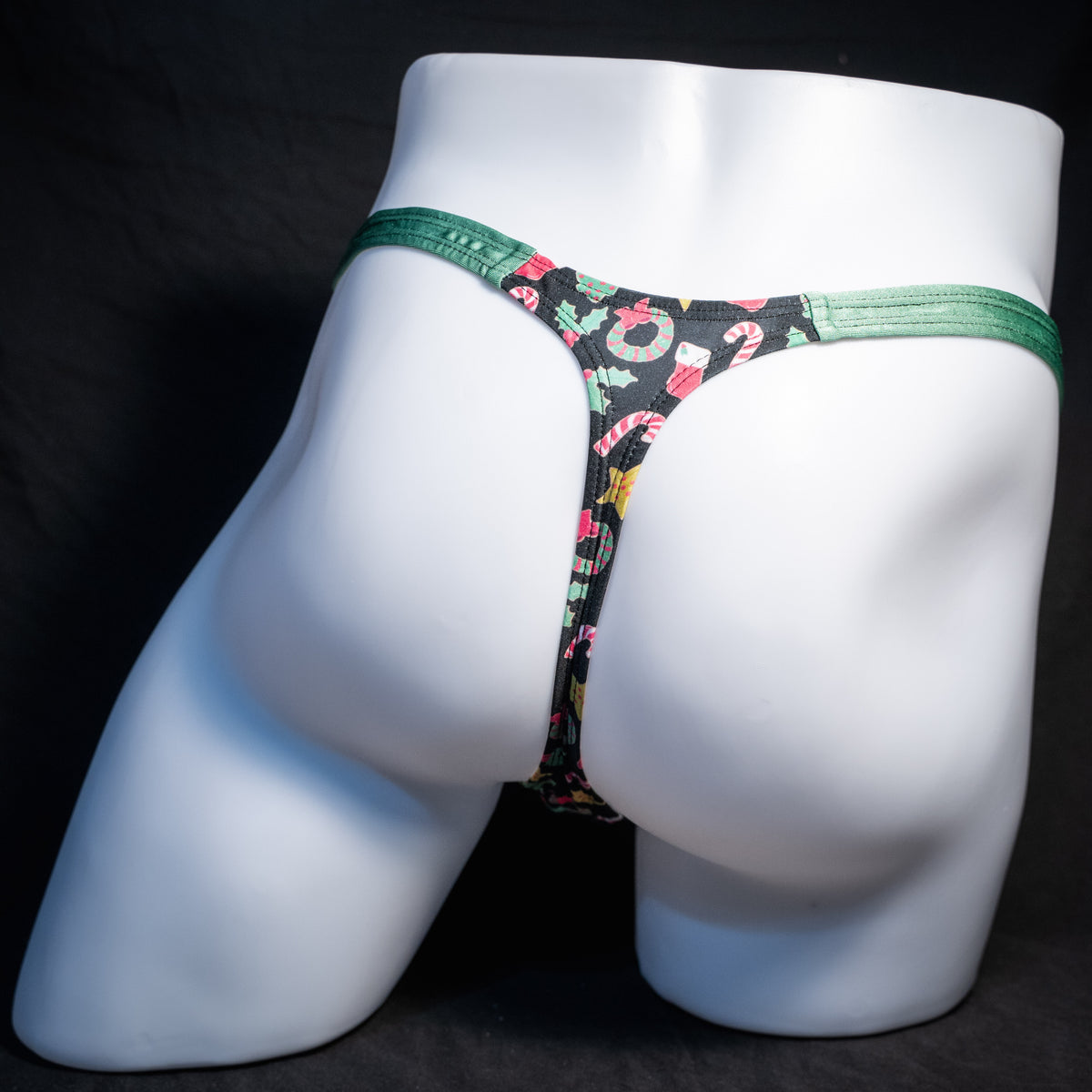 Men's Christmas themed thong underwear, classic cut, rear view.