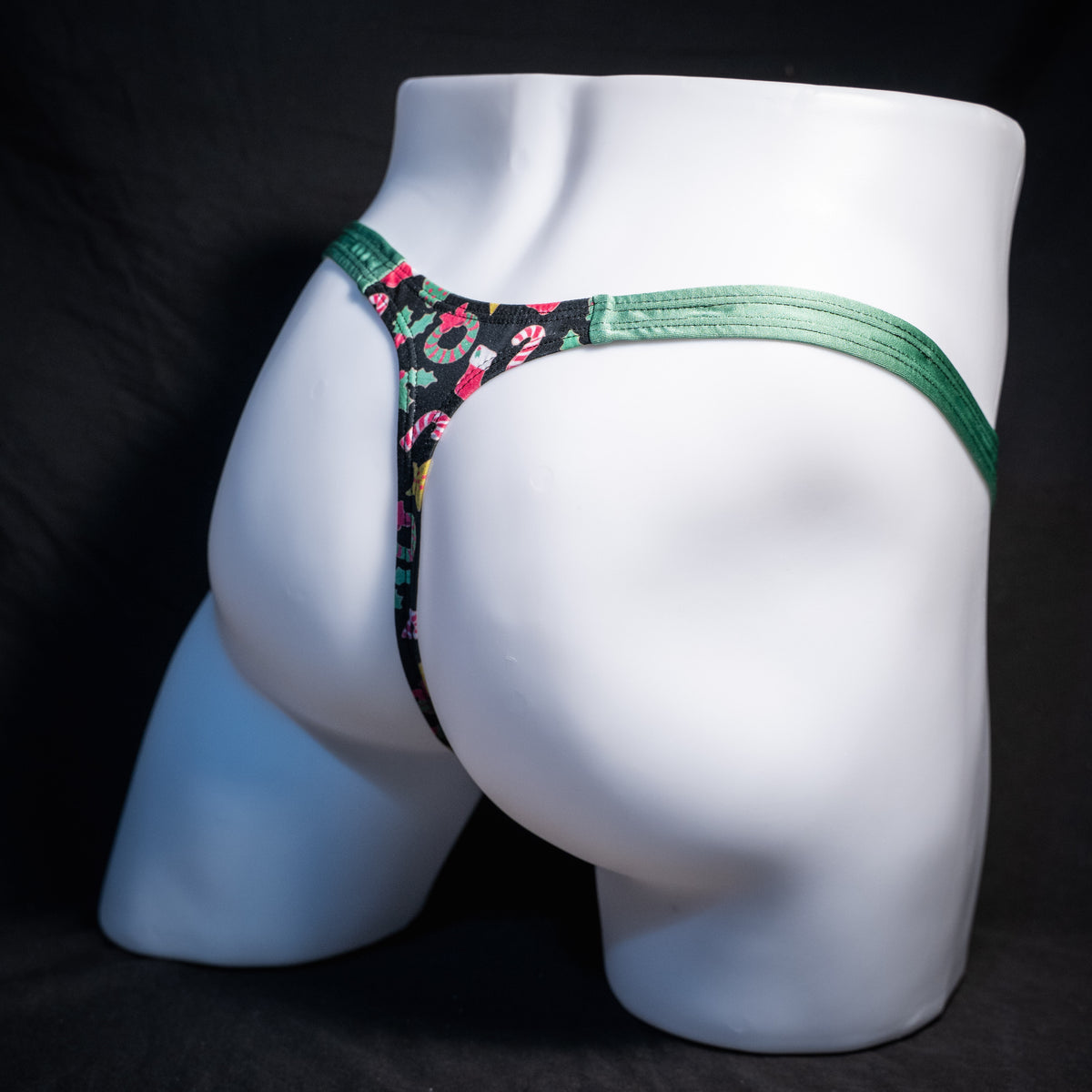 Men's Christmas themed thong underwear, classic cut, rear view.