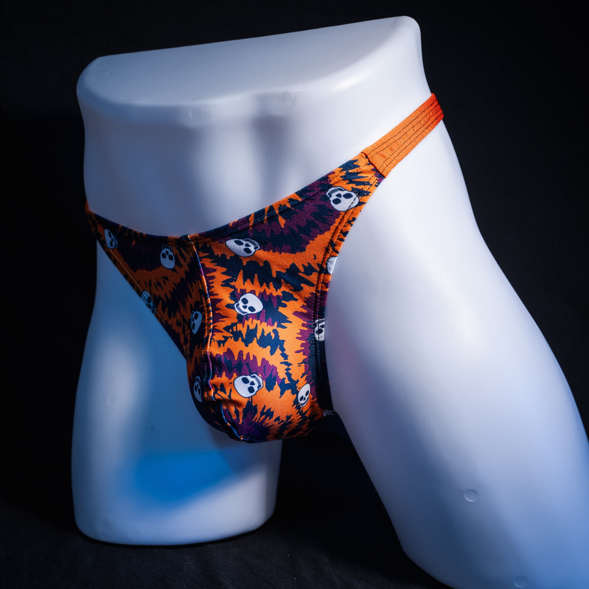 Men's Halloween Tie Dye with skulls thong underwear, classic cut, front view.