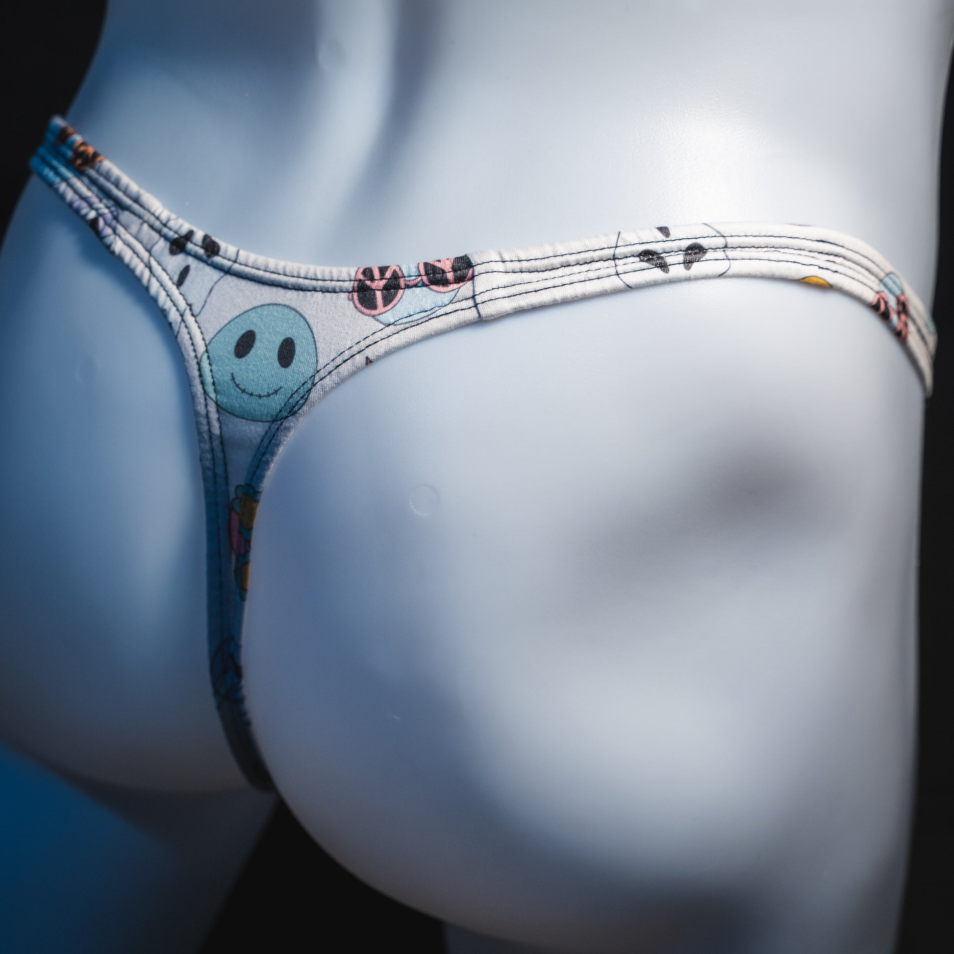 Men's Halloween pals thong underwear, classic cut, rear angled view.