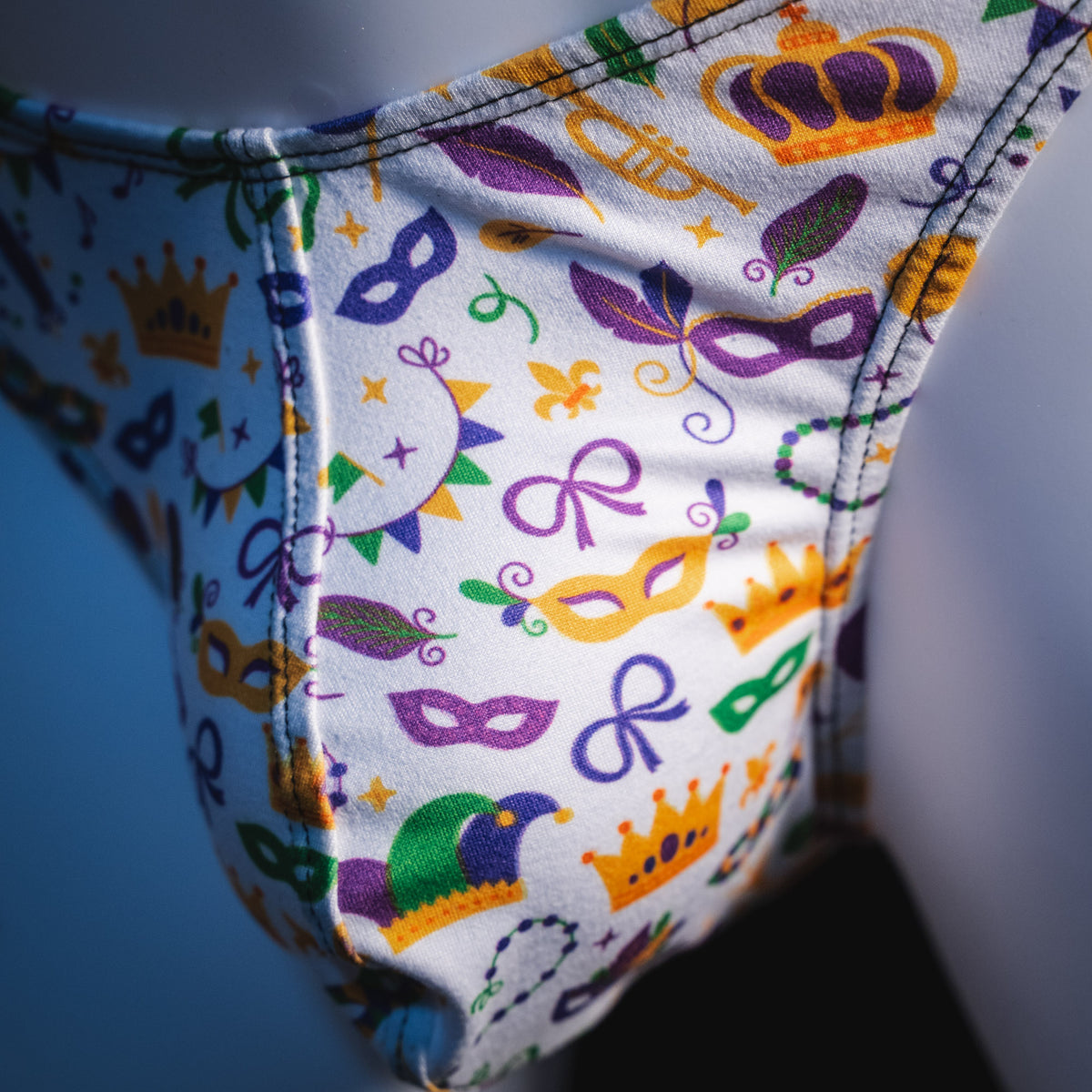 Men's Mardi Gras themed thong underwear, classic cut, detail view